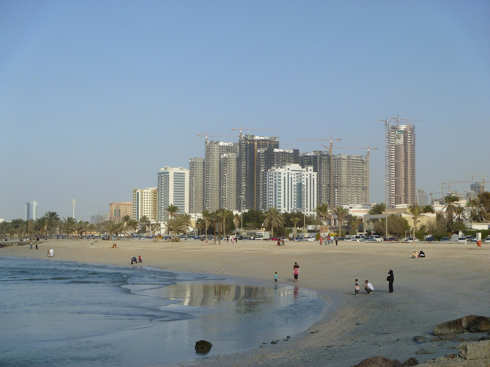 Ajman beach and the towers of the Corniche and Al Sawan